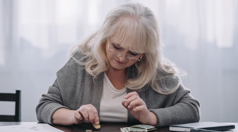 elderly woman doing her finances