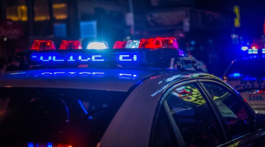Police car with its lights on at night