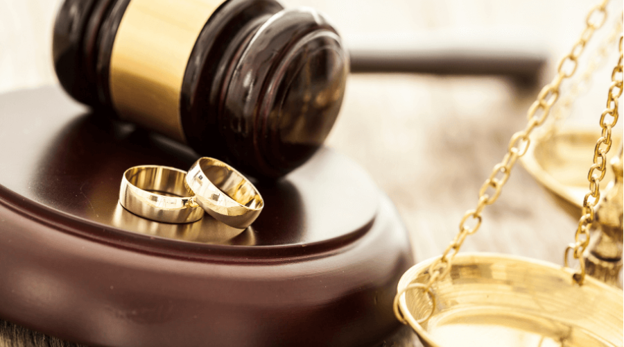 Wedding rings on a judge's desk